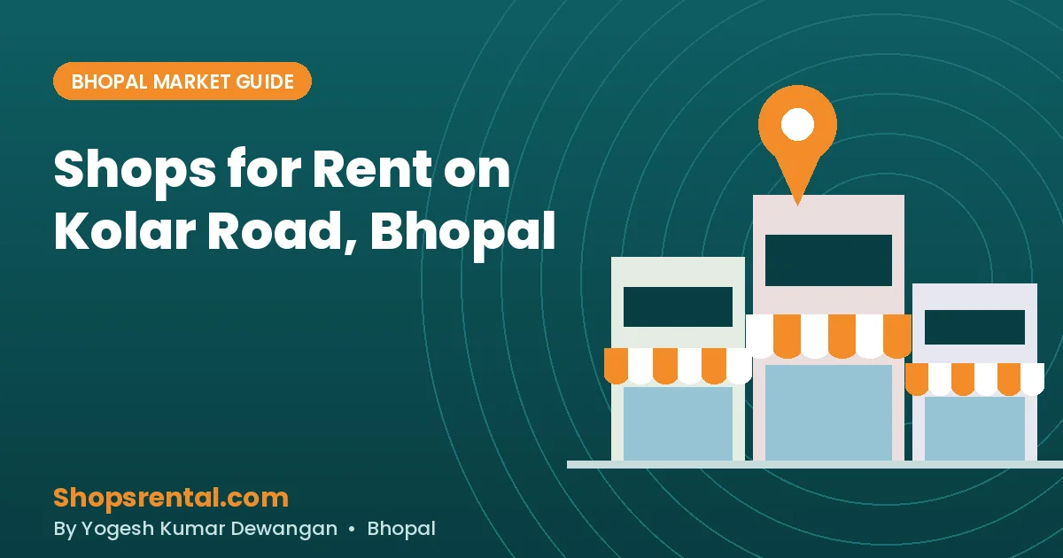 Row of ground-floor shops along the widened six-lane Kolar Road in Bhopal with shoppers and parked two-wheelers